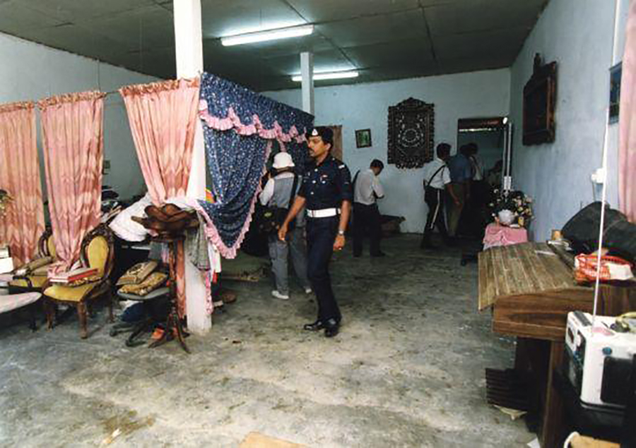 The Star The police combing through Mona's house in Raub.